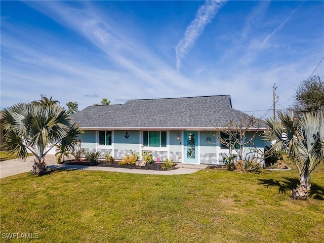 ranch-style house featuring a front yard