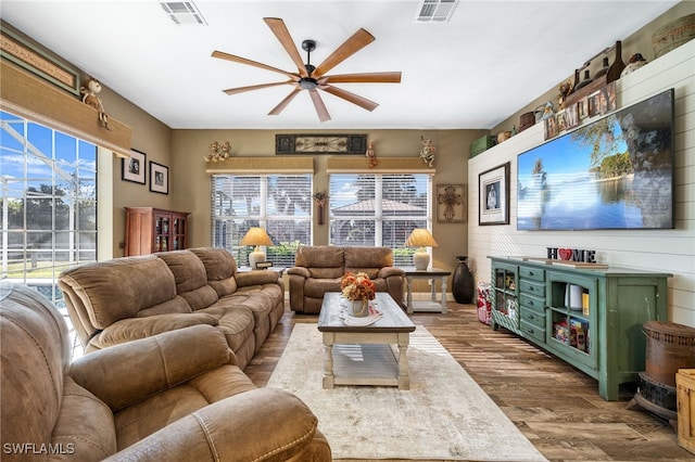 living room with ceiling fan and hardwood / wood-style floors