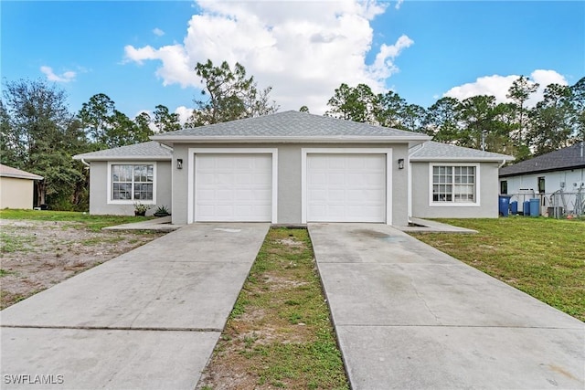 single story home featuring a garage and a front yard