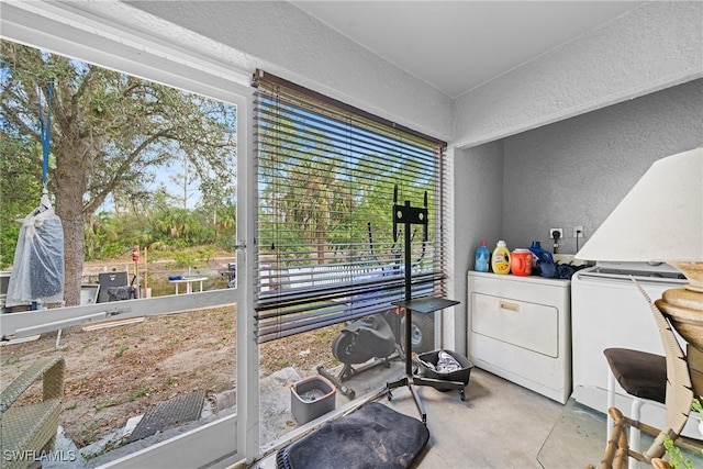 interior space featuring a wealth of natural light and washer and dryer