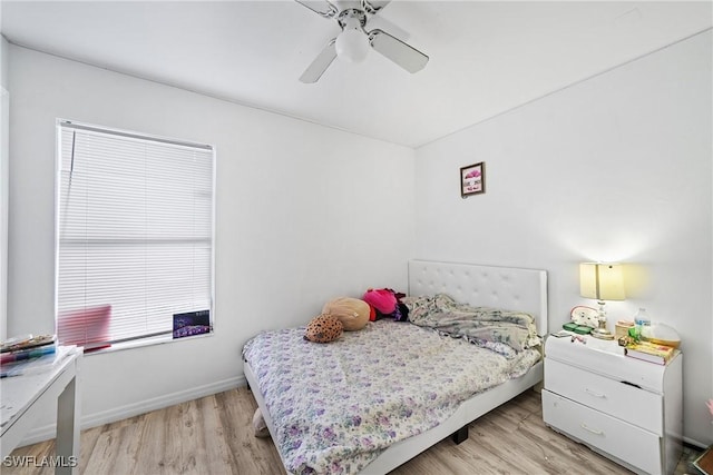 bedroom with ceiling fan and light wood-type flooring