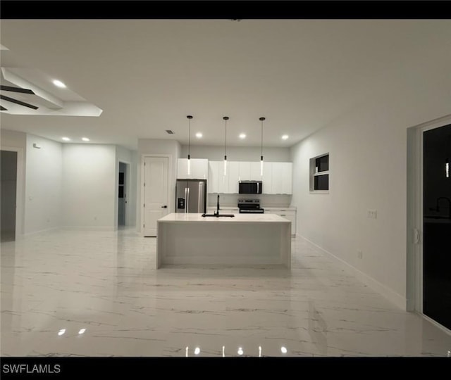 2704 15th St SW, Lehigh Acres, FL 33976 - kitchen with appliances with stainless steel finishes, a sink, recessed lighting, baseboards, and white cabinetry