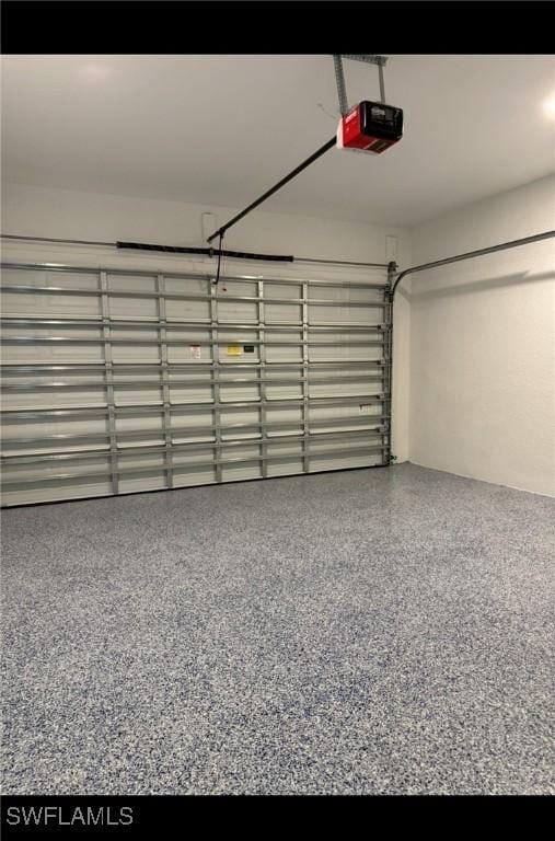 2704 15th St SW, Lehigh Acres, FL 33976 - garage featuring a garage door opener