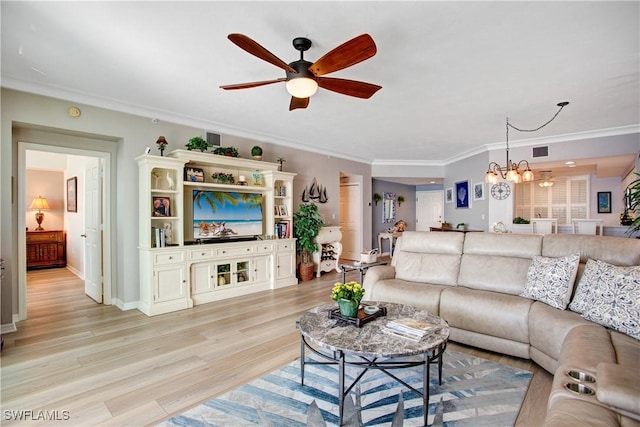 living room with crown molding, ceiling fan with notable chandelier, and light hardwood / wood-style floors