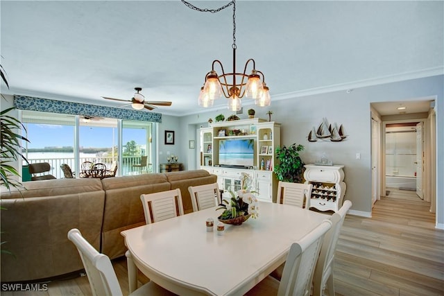 dining area with ornamental molding, ceiling fan, and light wood-type flooring