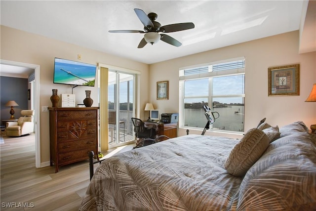 bedroom featuring access to exterior, ceiling fan, and light wood-type flooring