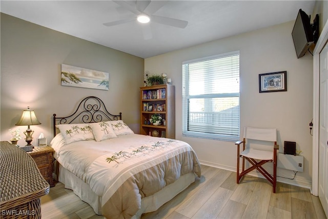 bedroom featuring ceiling fan and light wood-type flooring