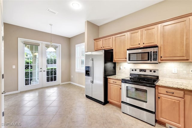 kitchen featuring stainless steel appliances, light stone counters, tasteful backsplash, light tile patterned flooring, and french doors