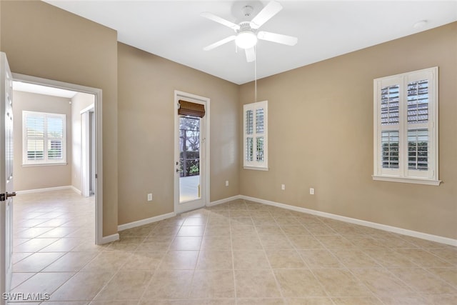 tiled empty room with ceiling fan