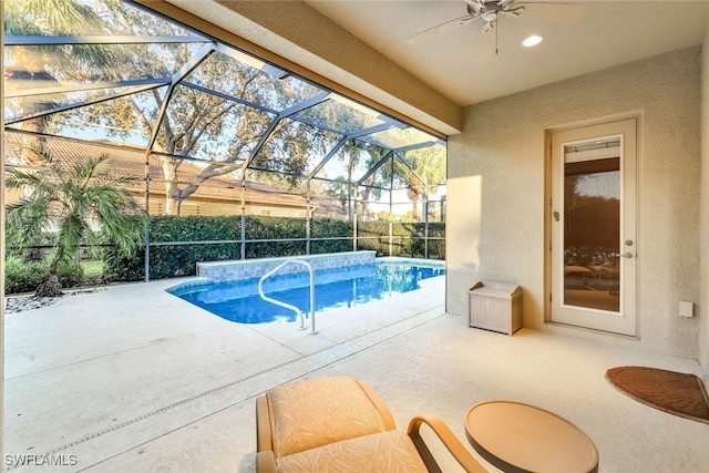 view of swimming pool with a lanai and a patio