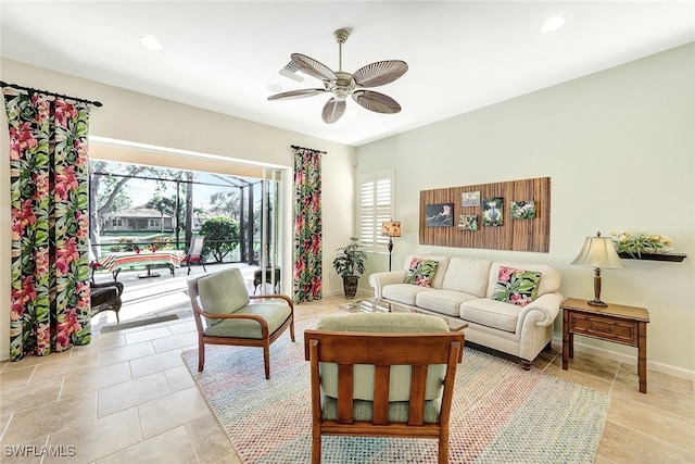 tiled living room featuring ceiling fan