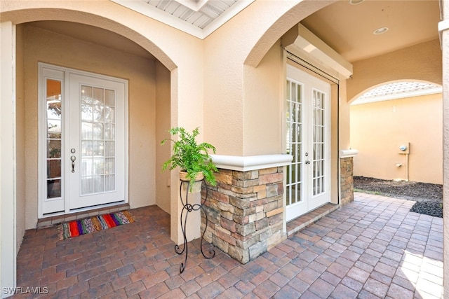 property entrance with french doors and a patio