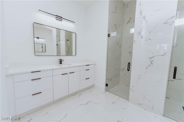 bathroom featuring vanity and an enclosed shower