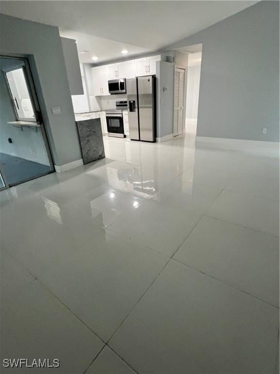 kitchen featuring white cabinets and appliances with stainless steel finishes