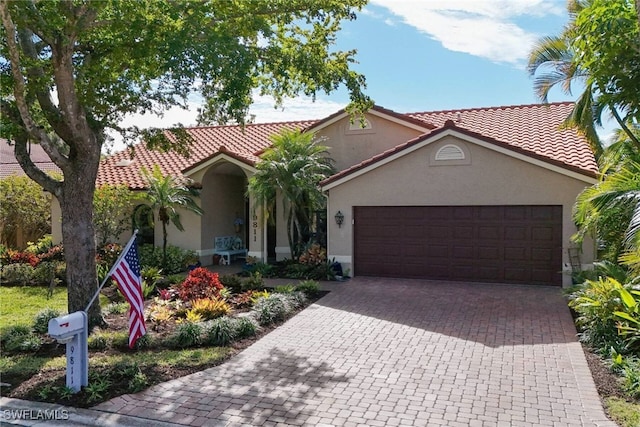 mediterranean / spanish-style house featuring a garage