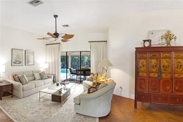 living room with ceiling fan and hardwood / wood-style floors