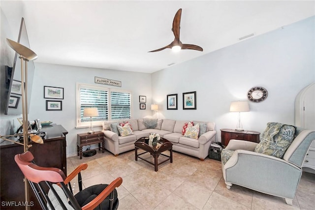 living room with light tile patterned flooring and ceiling fan