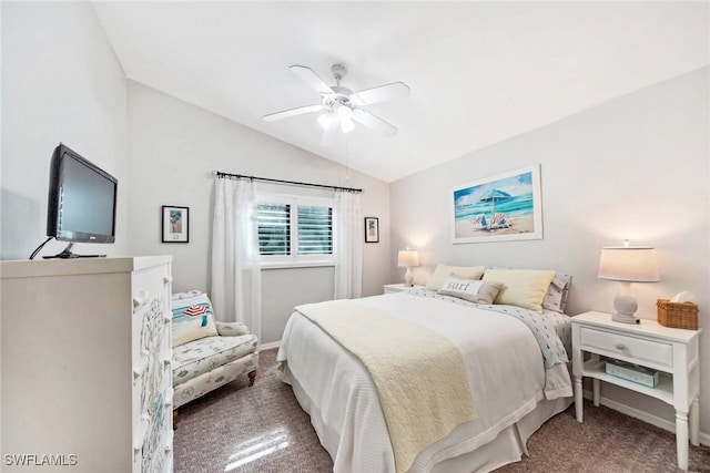 bedroom with ceiling fan, lofted ceiling, and carpet flooring