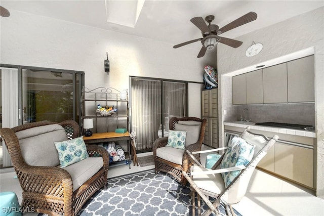 balcony featuring sink, a patio, and ceiling fan