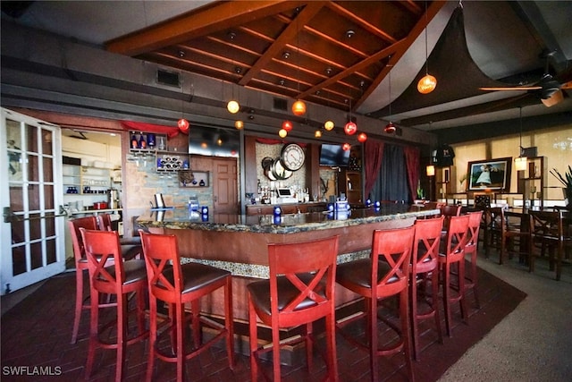 bar with beam ceiling, high vaulted ceiling, dark stone counters, and ceiling fan