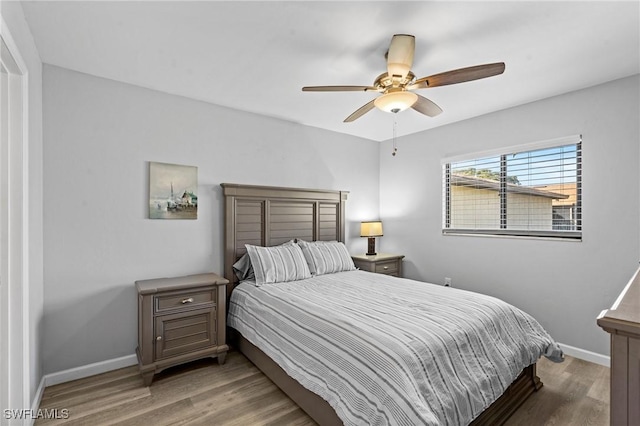 bedroom featuring wood-type flooring and ceiling fan