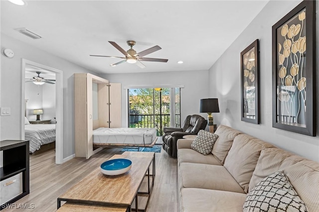 bedroom with ceiling fan and light hardwood / wood-style flooring