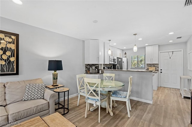 dining area featuring light hardwood / wood-style floors