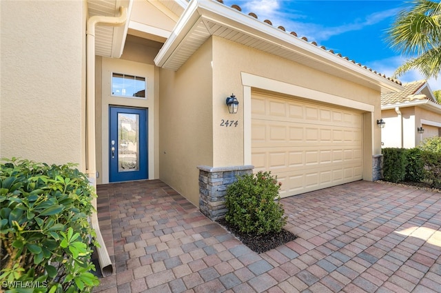 property entrance featuring a garage