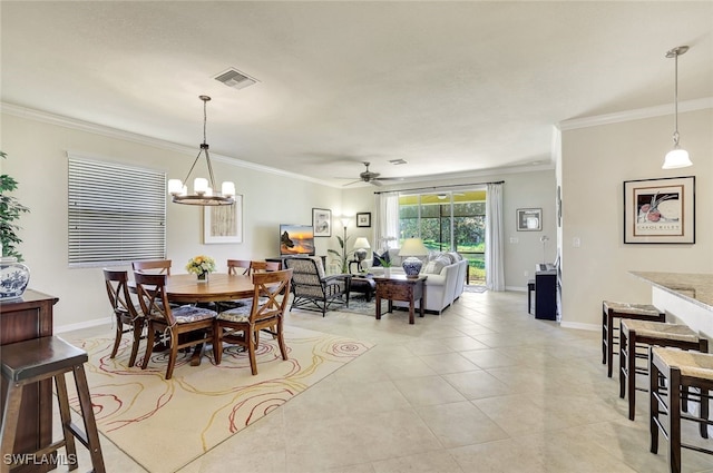 dining room featuring crown molding, ceiling fan with notable chandelier, and light tile patterned floors