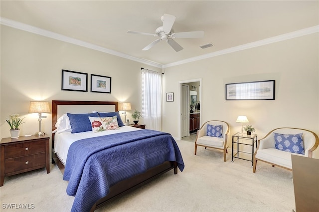 bedroom featuring ceiling fan, light colored carpet, ornamental molding, and ensuite bathroom