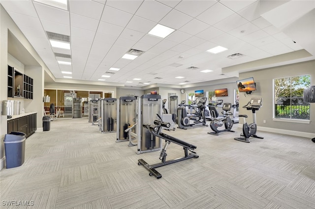 gym featuring light carpet