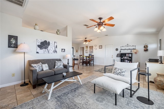 living room with lofted ceiling, tile patterned floors, and ceiling fan