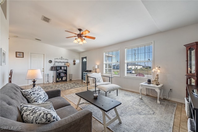 tiled living room featuring ceiling fan