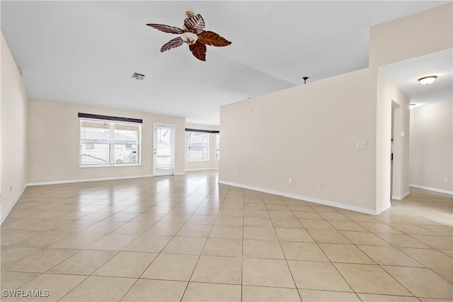 unfurnished room featuring light tile patterned floors and ceiling fan