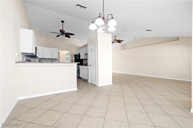 kitchen featuring white cabinetry, vaulted ceiling, kitchen peninsula, and ceiling fan with notable chandelier