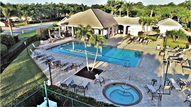 view of pool featuring a patio area and a hot tub