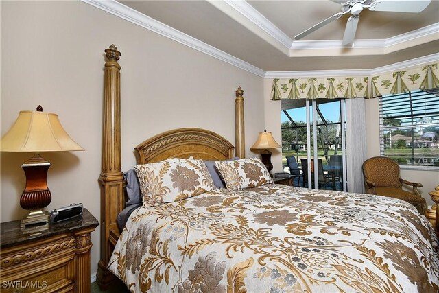 bedroom with ceiling fan, ornamental molding, access to exterior, and a raised ceiling