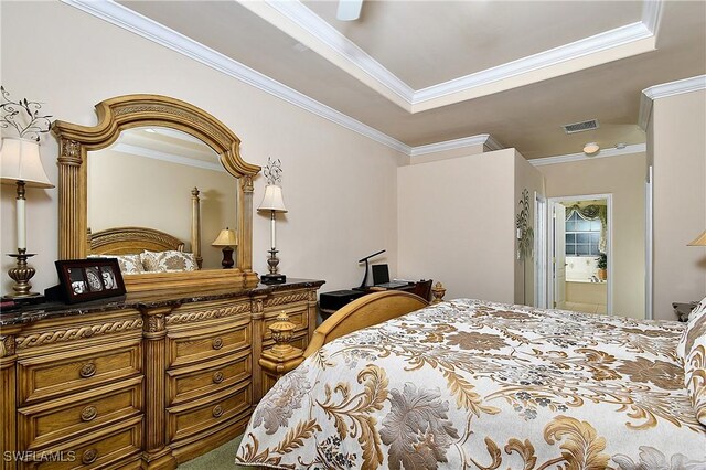 carpeted bedroom featuring ornamental molding and connected bathroom