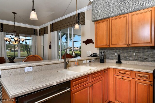 kitchen with sink, crown molding, hanging light fixtures, black dishwasher, and a healthy amount of sunlight