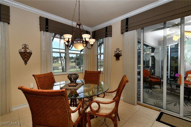 tiled dining room with ornamental molding and a notable chandelier