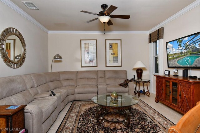 tiled living room featuring crown molding and ceiling fan