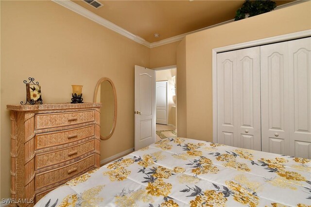 bedroom featuring ornamental molding and a closet