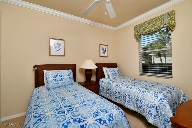 carpeted bedroom featuring crown molding and ceiling fan