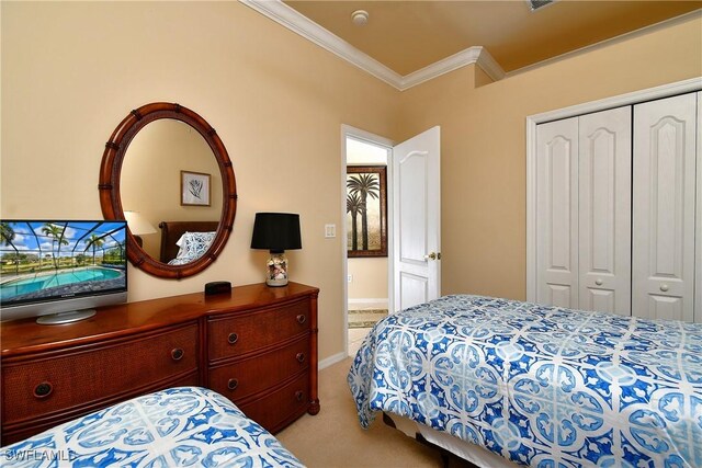 bedroom featuring ornamental molding, light colored carpet, and a closet