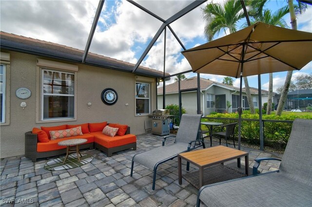 view of patio / terrace featuring a lanai, grilling area, and outdoor lounge area