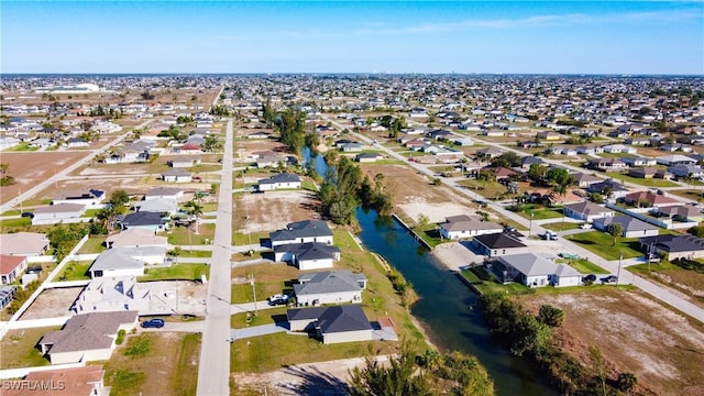 aerial view with a water view and a residential view