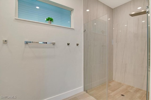 bathroom with a tile shower