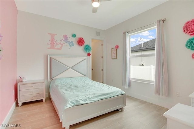 bedroom featuring ceiling fan and light wood-type flooring