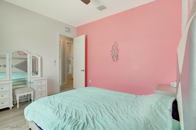 bedroom with ceiling fan and light hardwood / wood-style floors