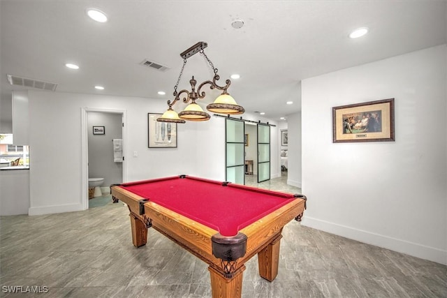 rec room with a barn door and pool table